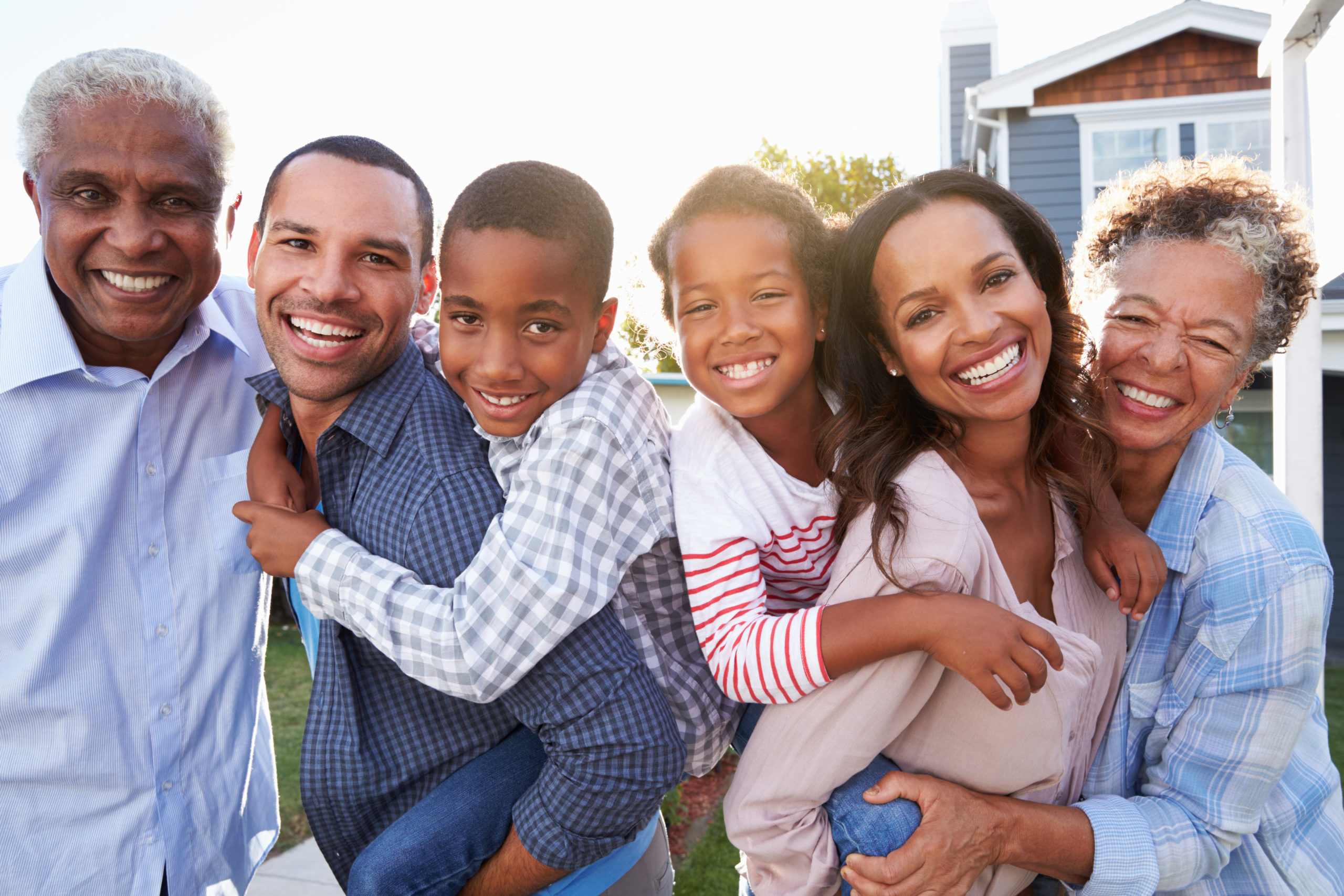 Outdoor group portrait of black multi generation family