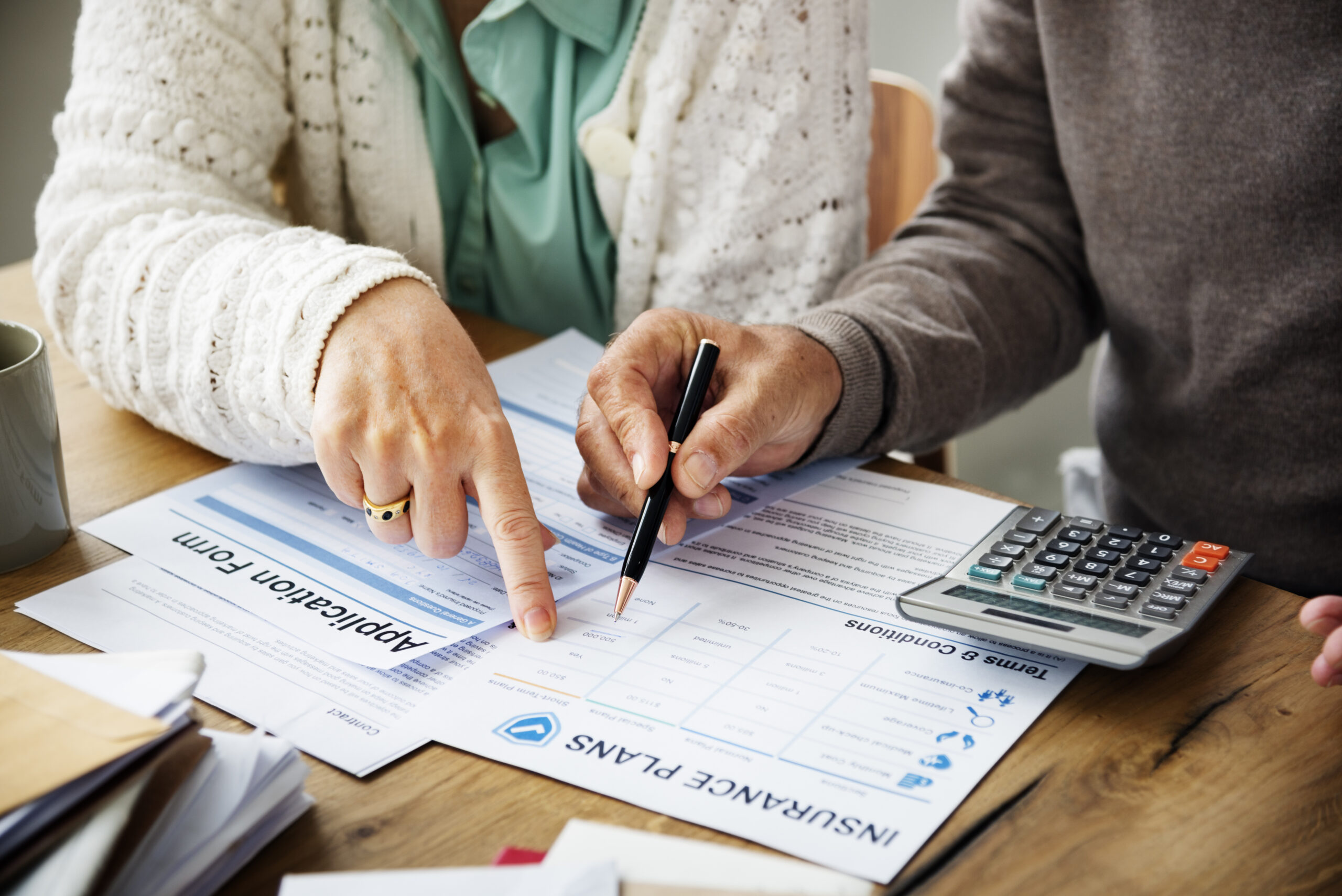 Individuals review health insurance options.