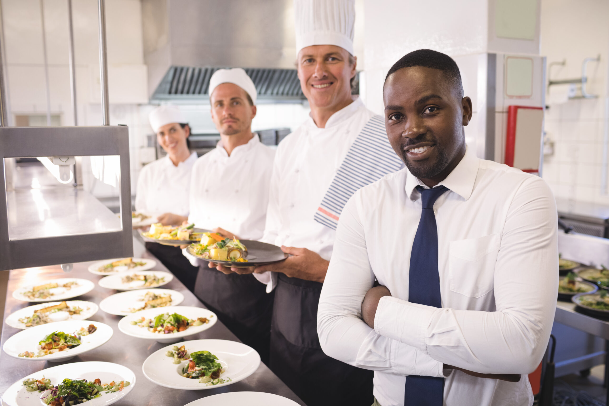 Restaurant manager with his kitchen staff